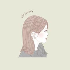 耳ツボジュエリーを付けた女性のイラスト